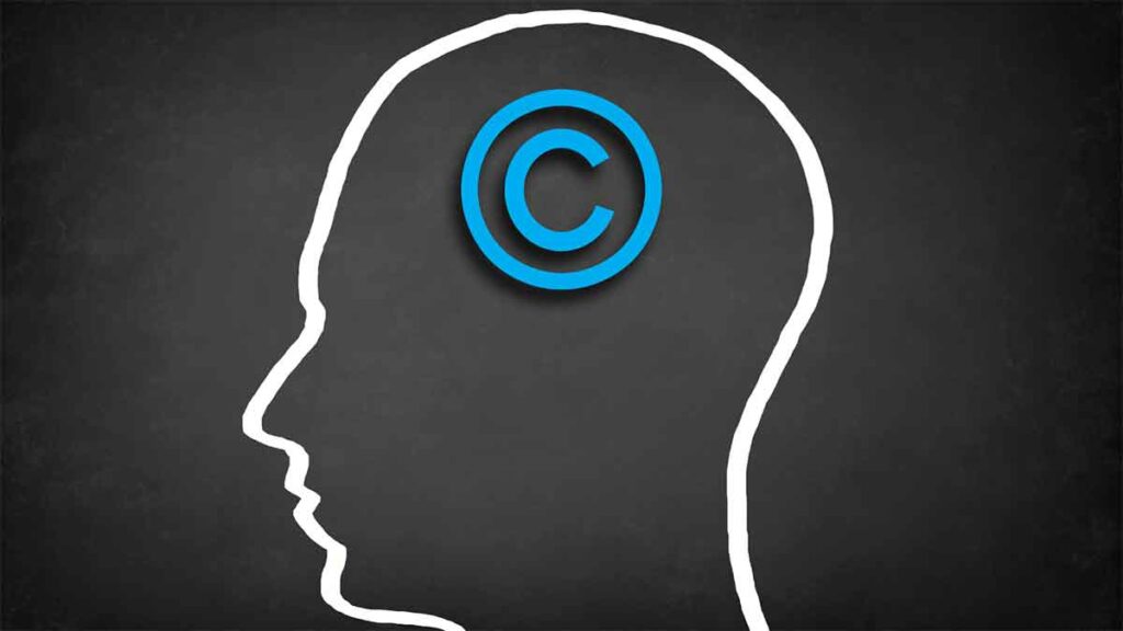 A silhouette of a head with a blue copyright symbol inside it