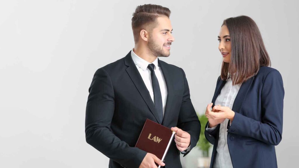 Lawyers facing each other in conversation.