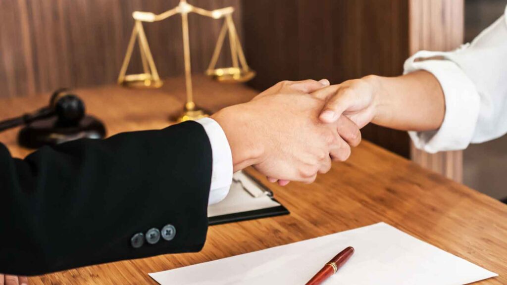 Professional discussion between a client and attorney at a desk