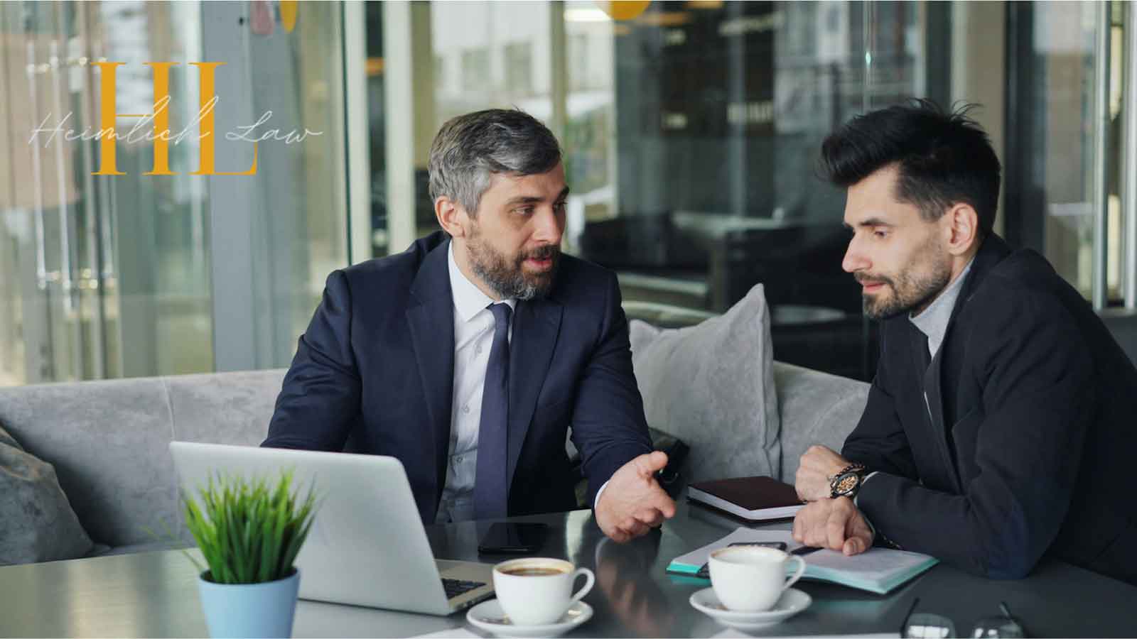 Two men having a discussion in a modern office setting