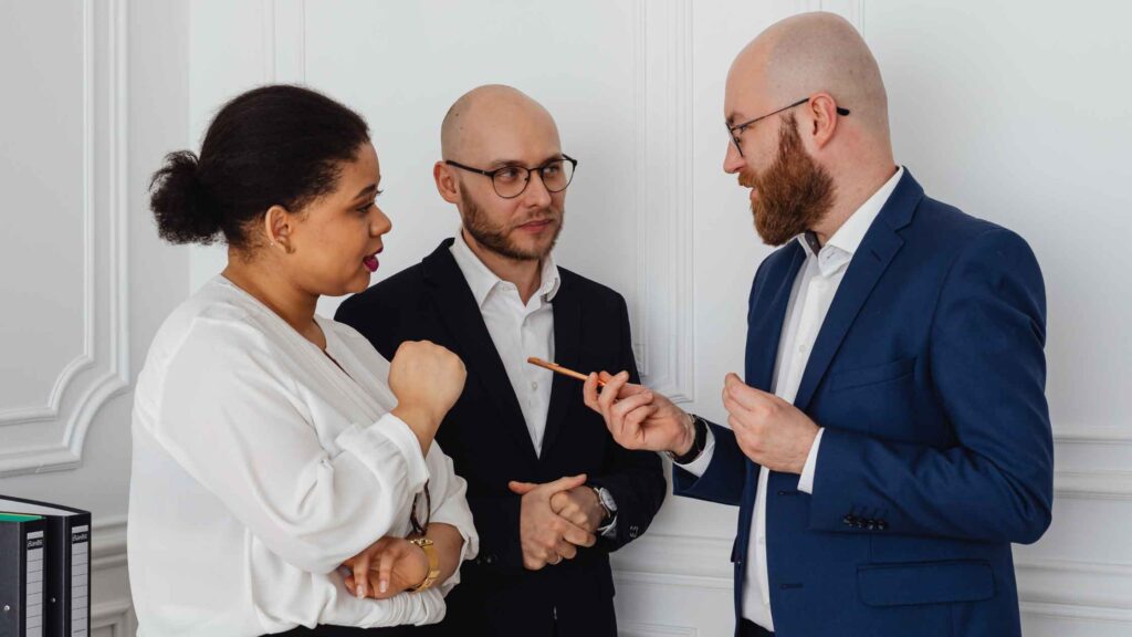 A group of lawyers discussing together in a room